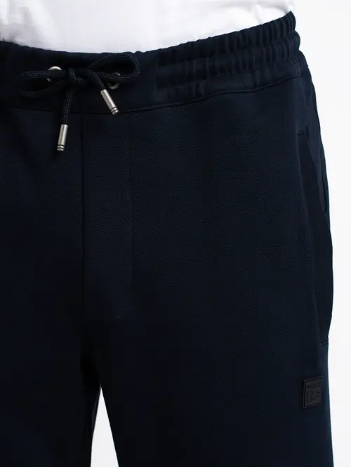 SPODNJI DEL TRENIRKE V JOGGER STILU REGULAR TEMNO MODRA XL